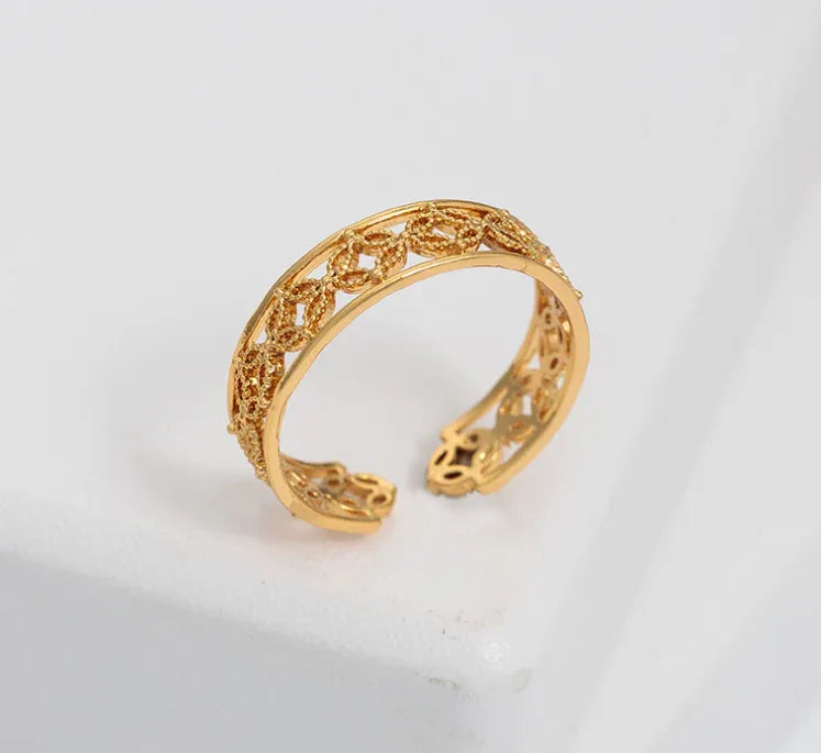 Close-up of Hélodie Ring showing smooth, adjustable gold band with subtle texture