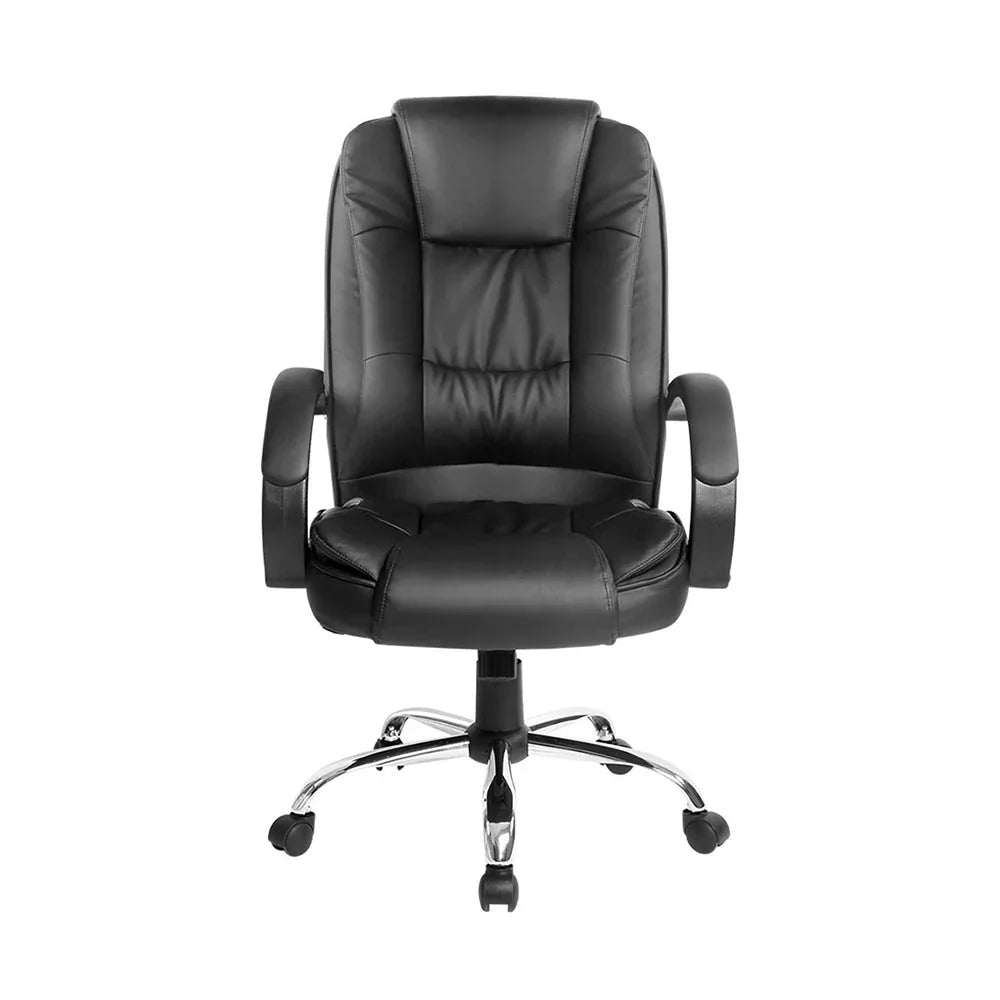 Close-up of padded headrest and backrest of the black leather office chair showing stitching detail.