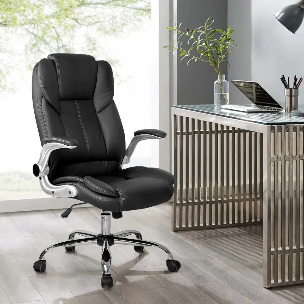 Black leather office chair angled to show both back support and retractable armrest