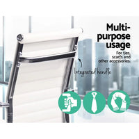 White Artiss gaming office chair with mid-back and cushioned seat positioned on smooth floor.