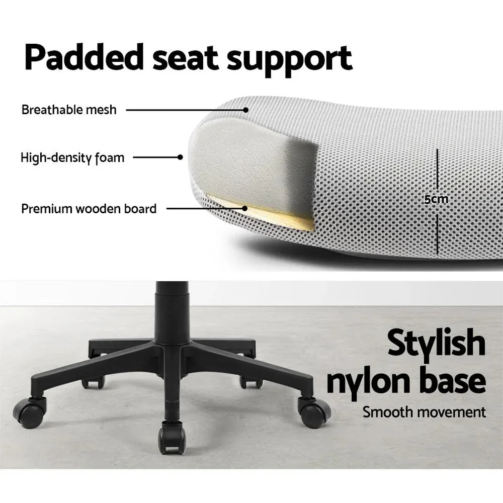 Office chair positioned at desk with ergonomic design and padded seat.