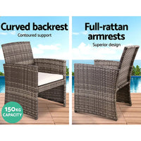Outdoor lounge setting on patio with 4-piece rattan furniture including table and cushioned seating.