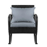 Close-up of the rocking chair's woven wicker texture and plush cushioned seat.
