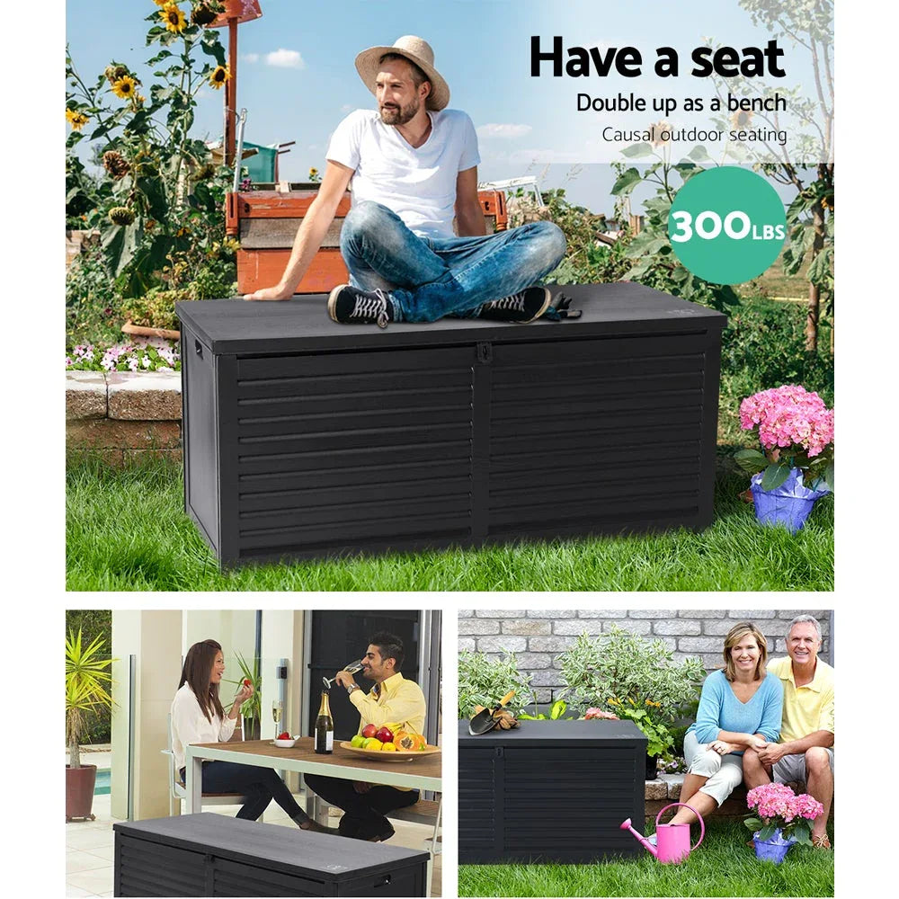 Outdoor storage box placed on grass near garden chairs and table.