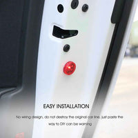 Wireless car door warning light pair glowing red, attached to open car door at night for increased safety.