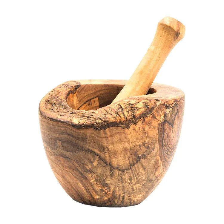 Close-up of olive wood rustic mortar with pestle showing natural grain patterns.