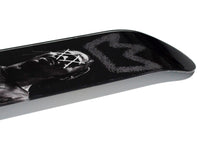 King Travis Skateboard displayed diagonally on white background.