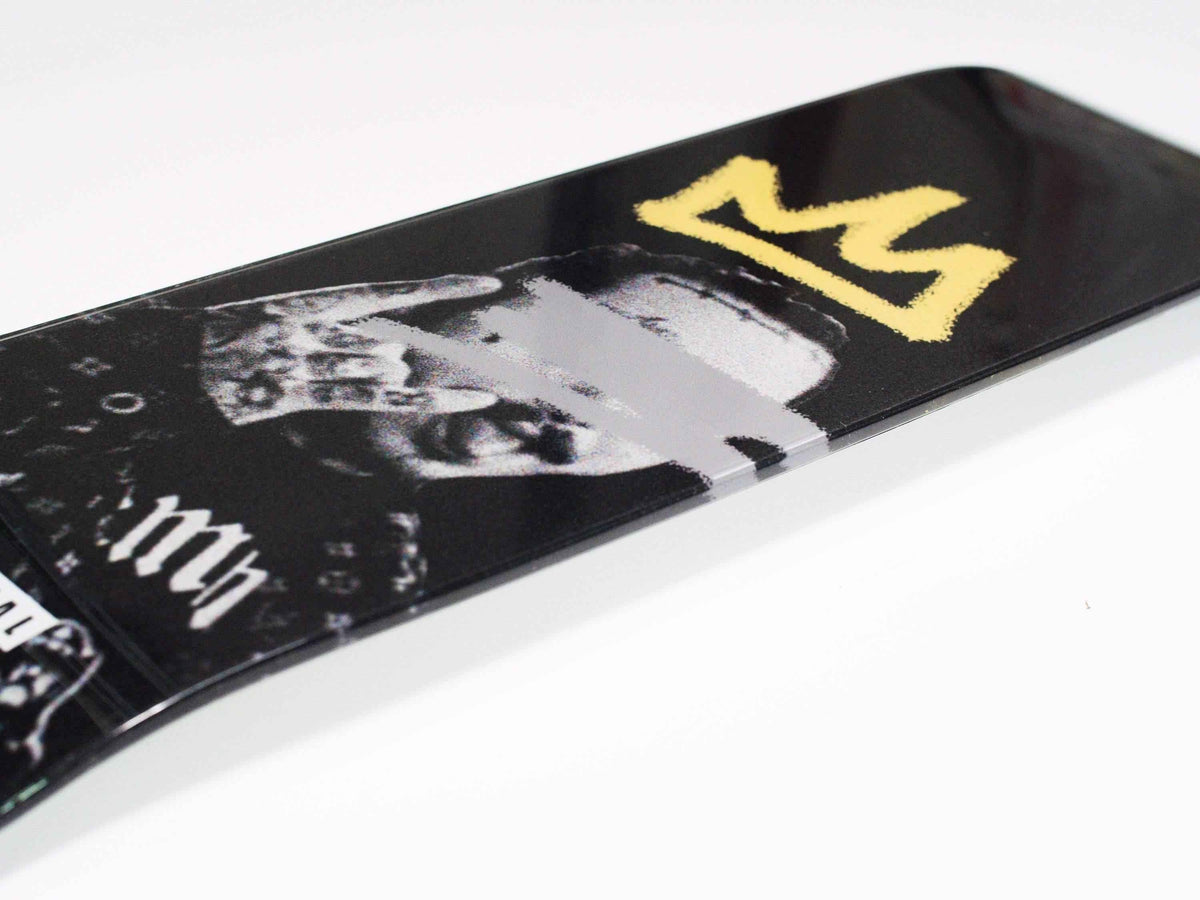 Side view of Posty Skateboard highlighting the deck shape and wheel setup.