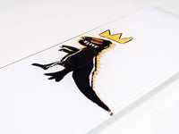 Close-up of the dinosaur skateboard graphic showing vibrant green and yellow colors