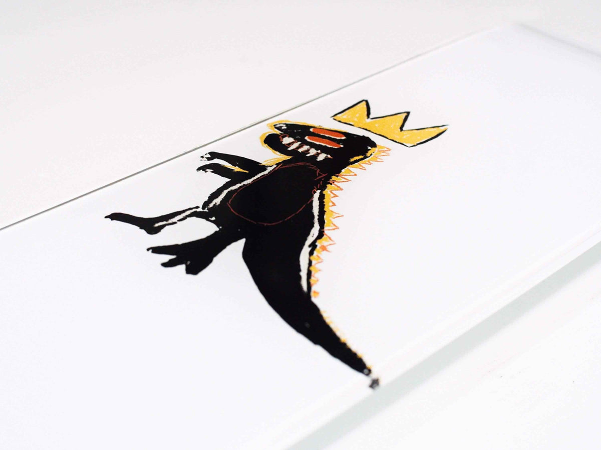 Close-up of the dinosaur skateboard graphic showing vibrant green and yellow colors