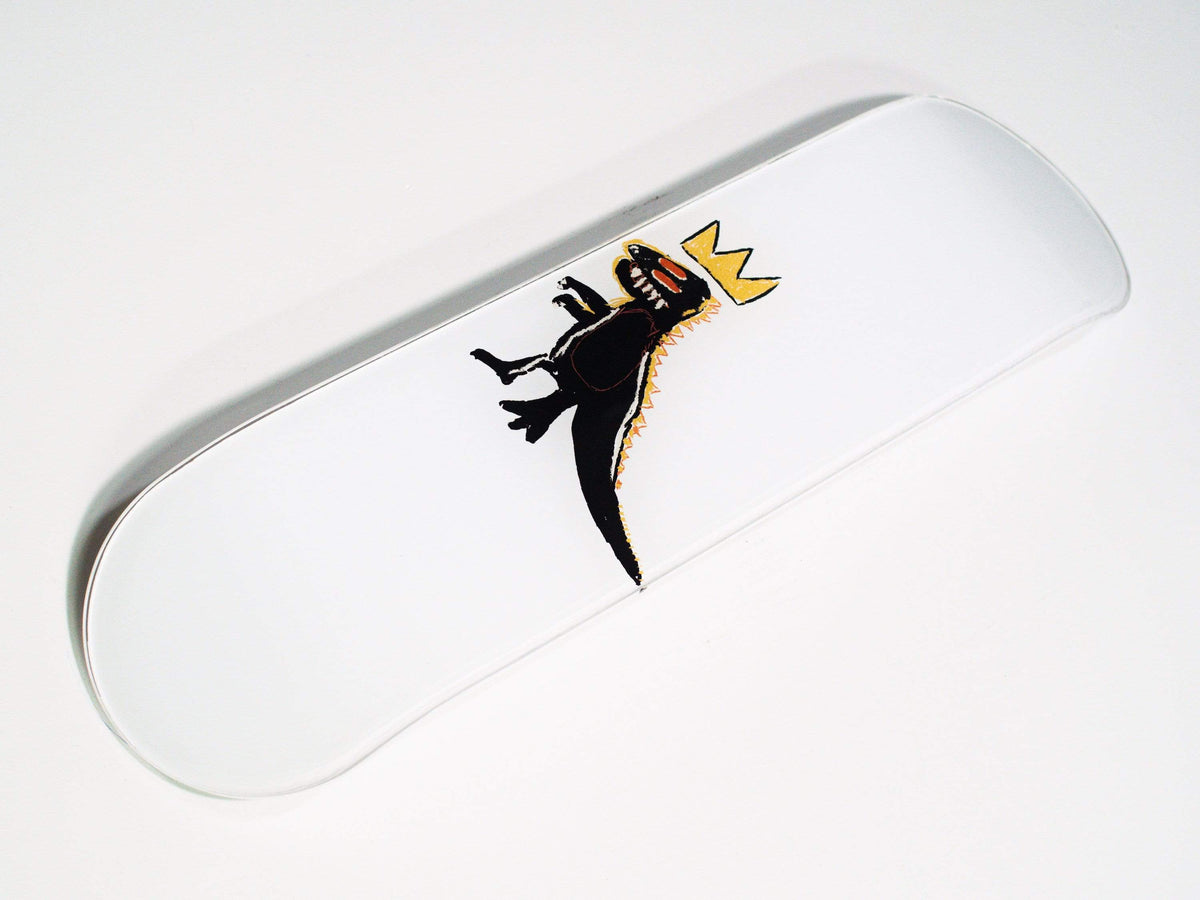 Side view of skateboard highlighting curved edges and dinosaur artwork