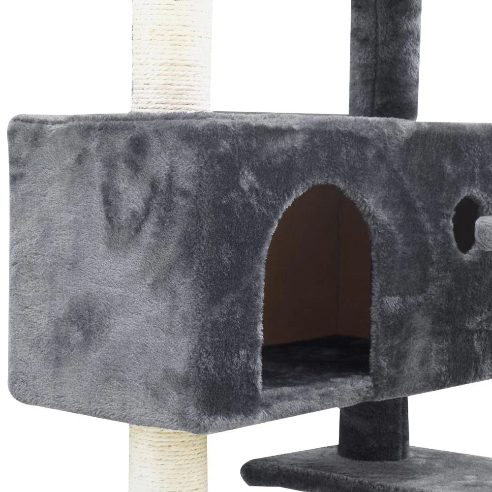 View of sisal-covered posts and soft platforms on a tall cat scratching post tower.