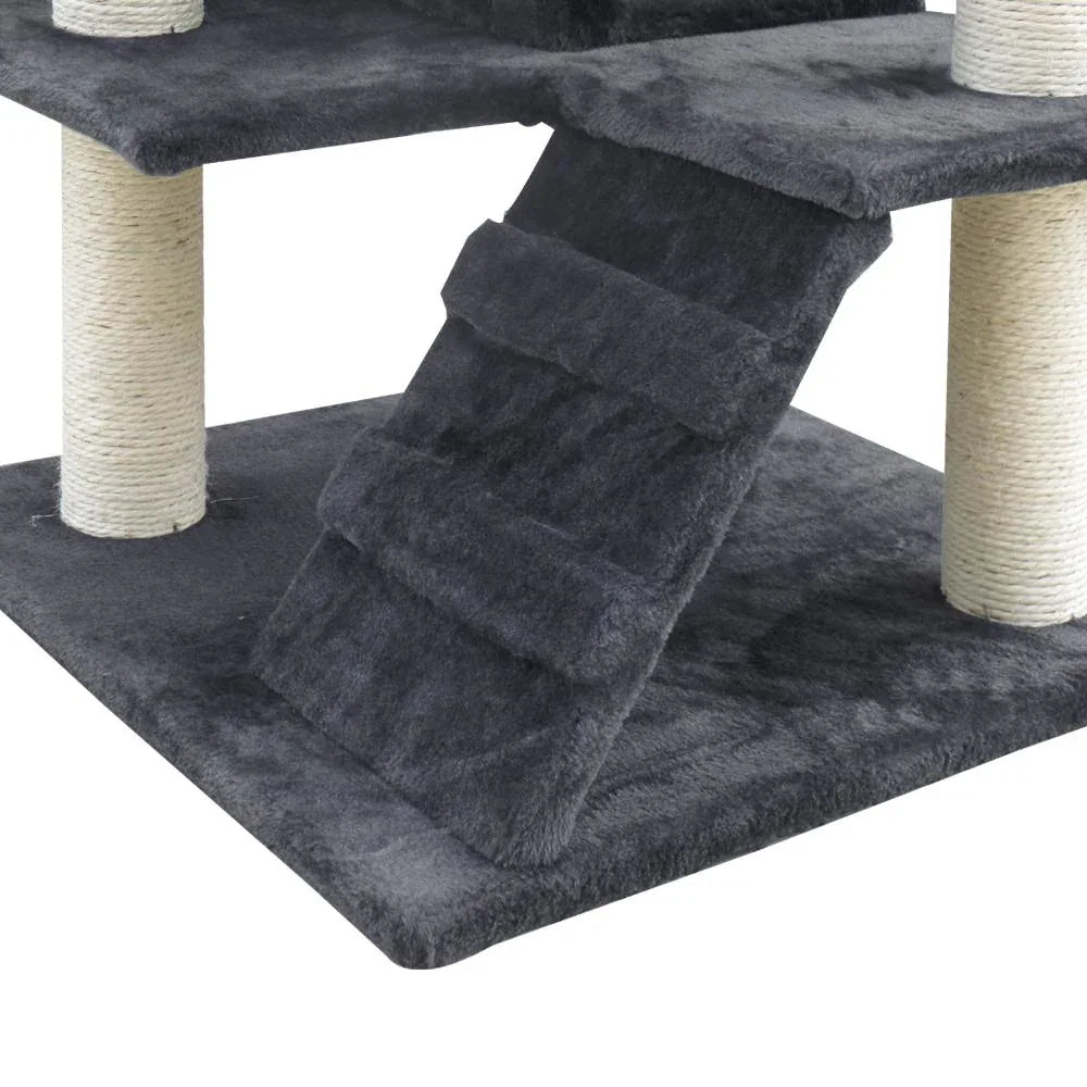 Detailed look at velvety surfaces and support columns of gray cat tree for scratching and lounging.