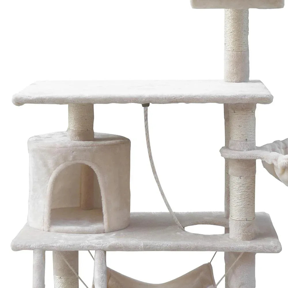 View of the cat condo with entry opening and velvety beige covering.
