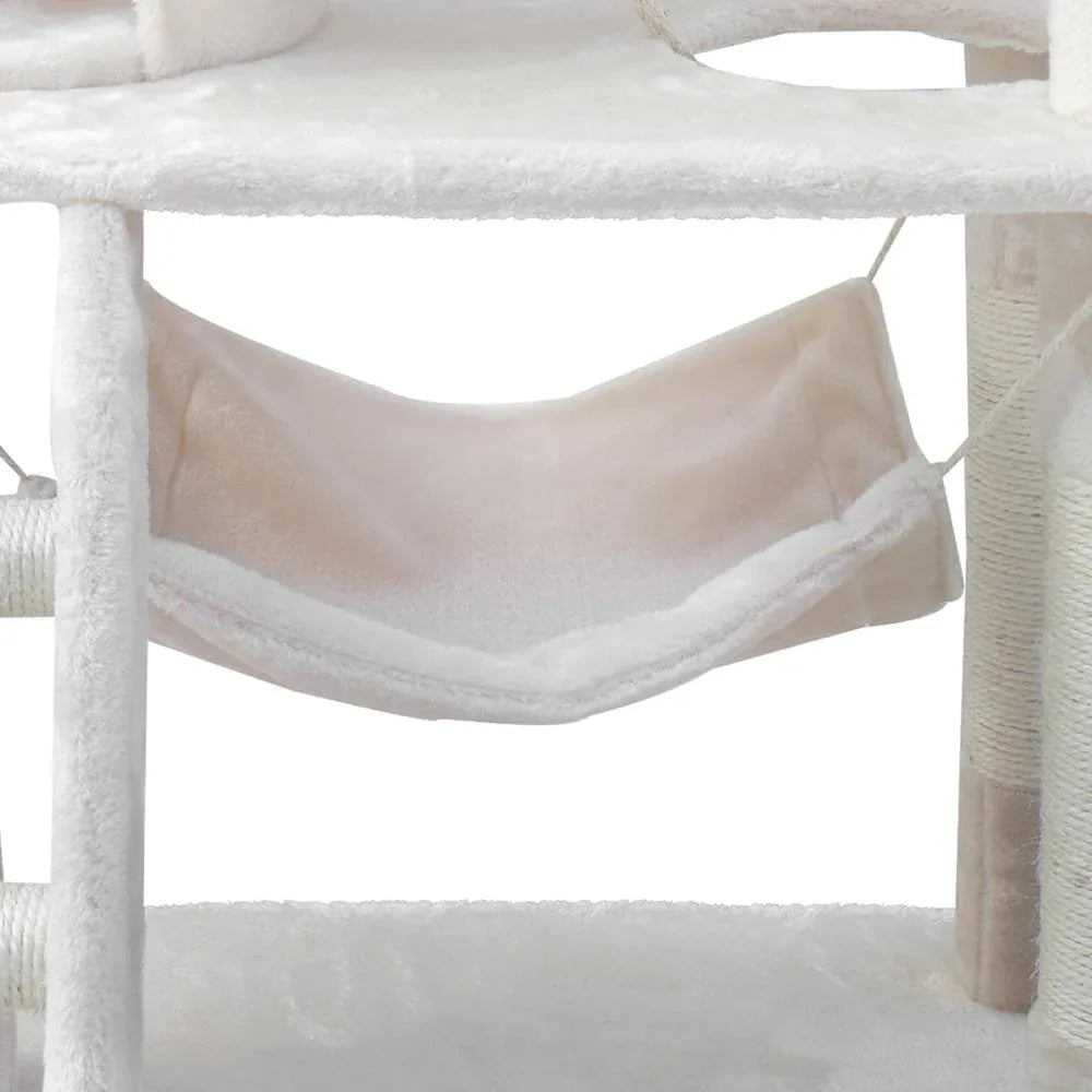 Close-up of sisal rope wrapped around scratching post on beige cat tree.