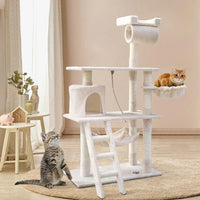 Full view of tall beige cat tree with multiple levels, hiding areas, and vertical posts.