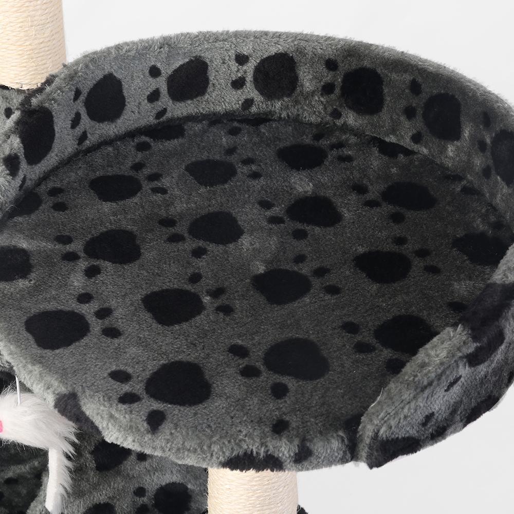 Multi-level beige cat tree showing climbing posts and lounging platforms in a cozy setup.