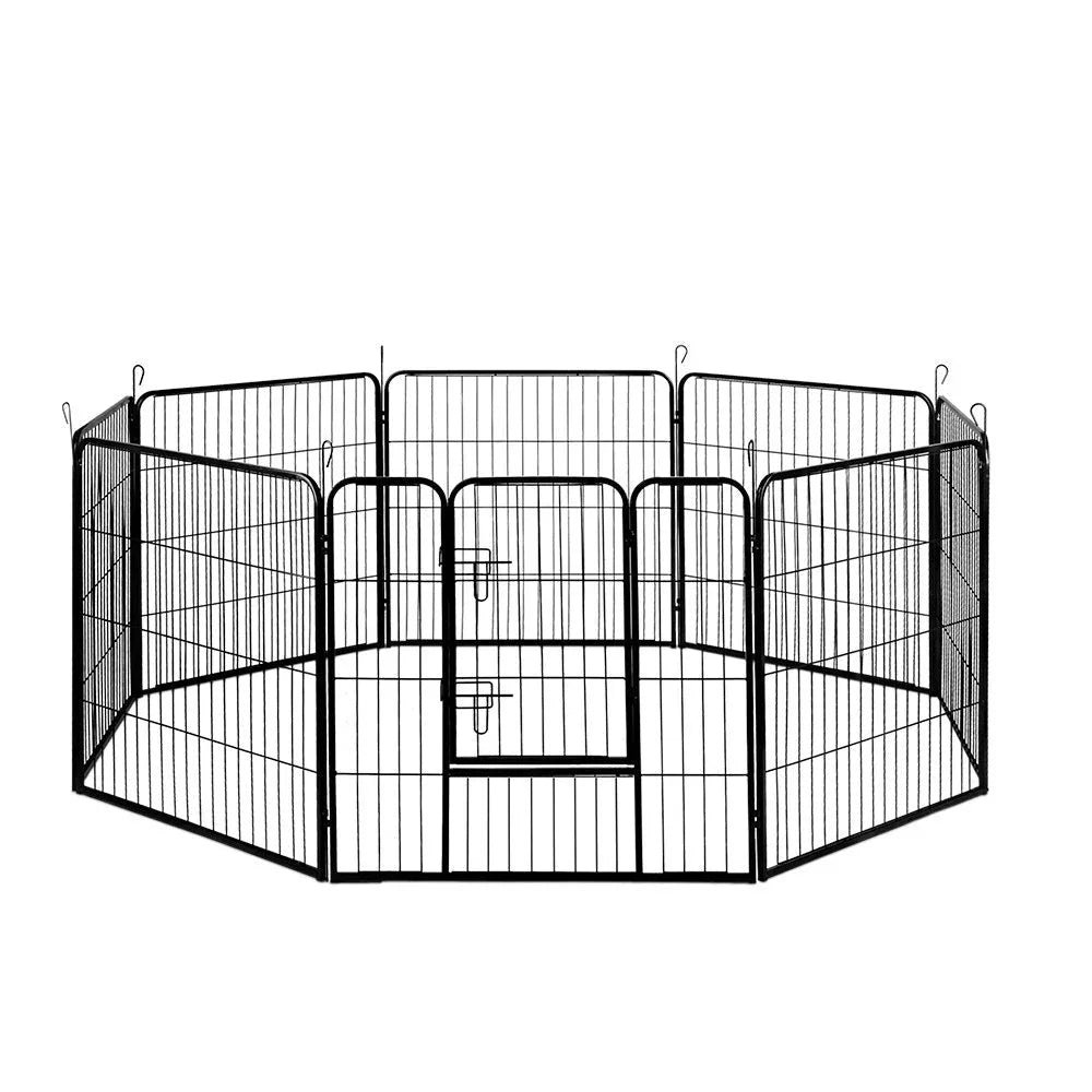 Black 8-panel pet playpen set up as an octagon on wooden floor, ideal for small dogs or puppies.