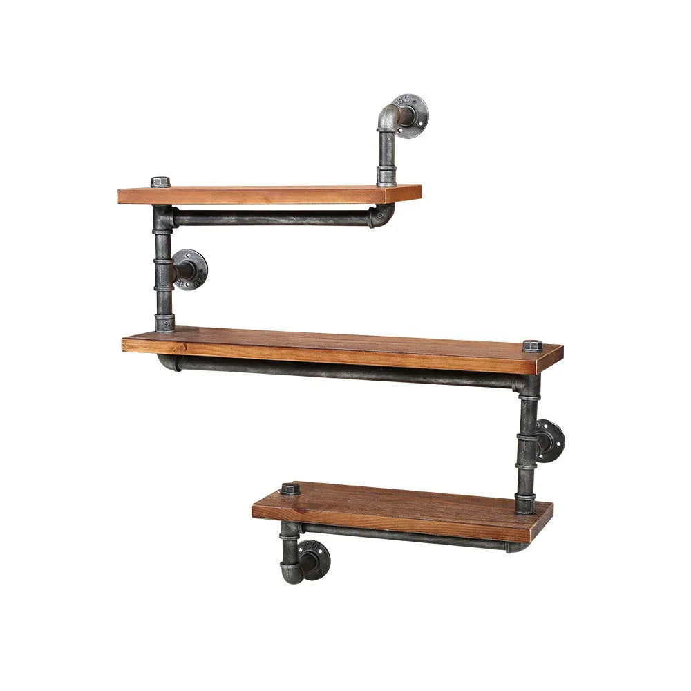 Rustic industrial three-level pipe wall shelf displaying decor and books in modern living room