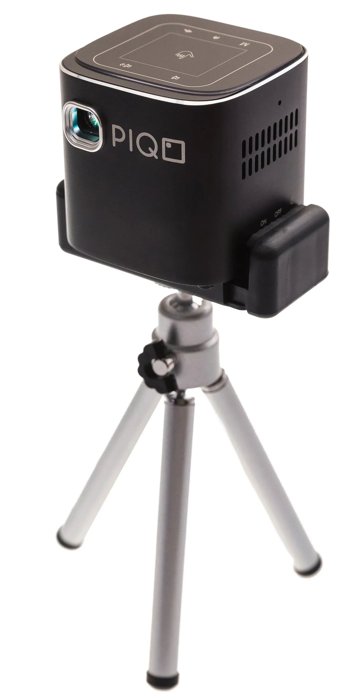 PIQO projector displaying streaming content with Android interface on a white surface.