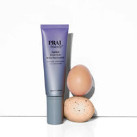Close-up of Ageless Even Glow serum bottle, highlighting the product's label and packaging by PRAI Beauty.