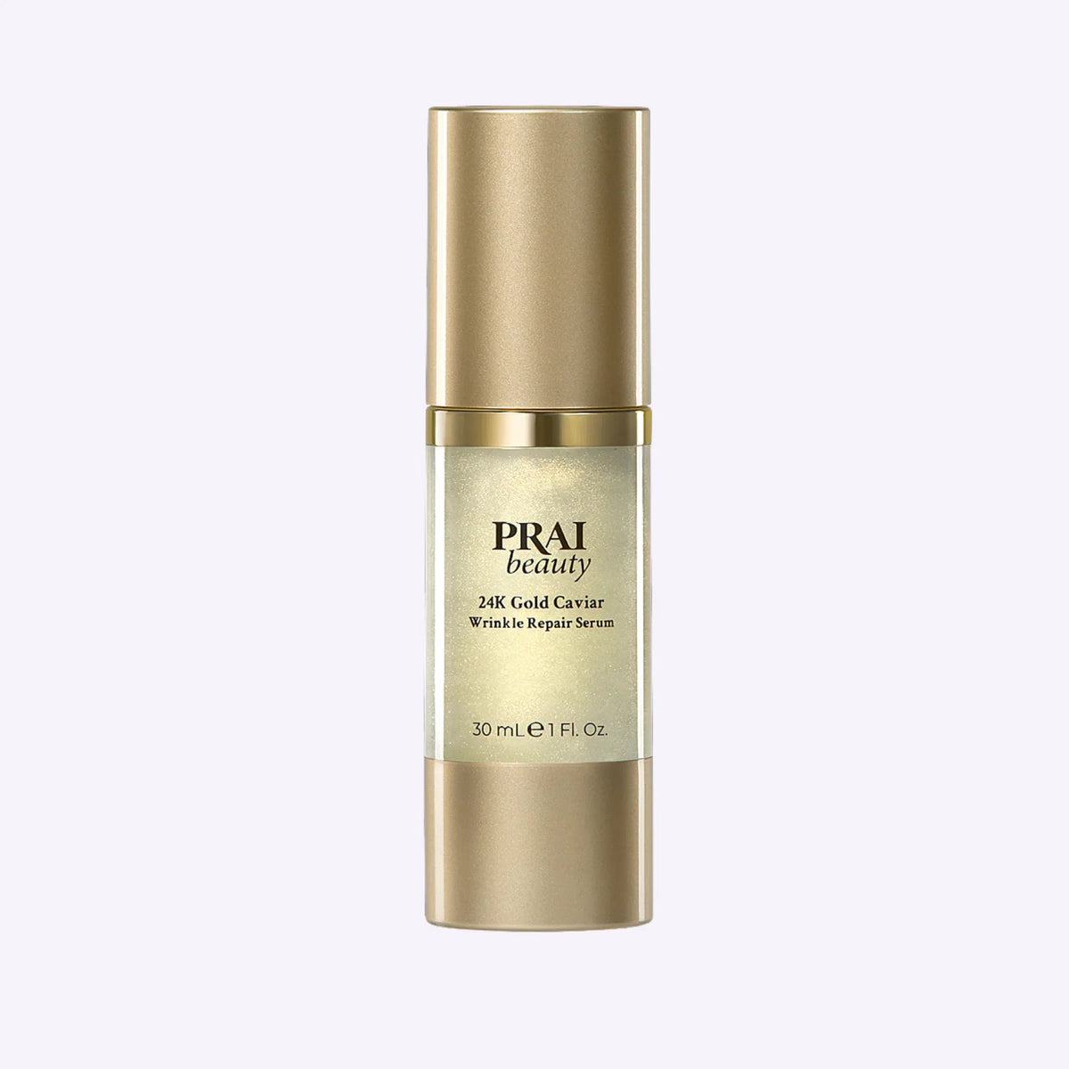 Bottle of PRAI Beauty 24K Gold Caviar Wrinkle Repair Serum with gold accents on label.