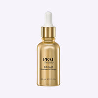Bottle of PRAI Beauty 24K Gold Precious Oil Drops with golden oil and botanical ingredients