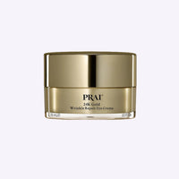PRAI Beauty 24K Gold Wrinkle Repair Eye Creme 15ml tube with gold and white packaging on white background