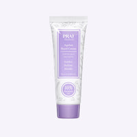 Small 15ml tube of PRAI Beauty Ageless Hand Creme displayed on white background