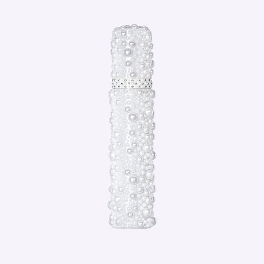 Ageless Throat Activating Serum bottle with pearl design packaging by PRAI Beauty on white background