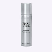 Compact PRAI Beauty Platinum Firm & Lift Serum 15ml bottle featuring elegant silver top and minimalist label.