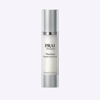 Bottle of PRAI Beauty Platinum Firm & Lift Serum 50ml with silver and white packaging on white background.