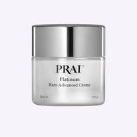 Jar of Platinum Rare Advanced Creme by PRAI Beauty with silver and blue packaging on white background