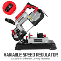Band saw cutting a piece of wood with adjustable blade guard and LED light on