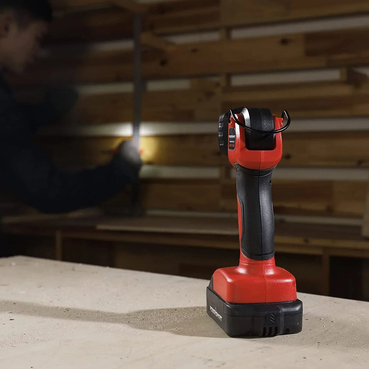20V LED work light positioned upright with pivoting head glowing bright white light