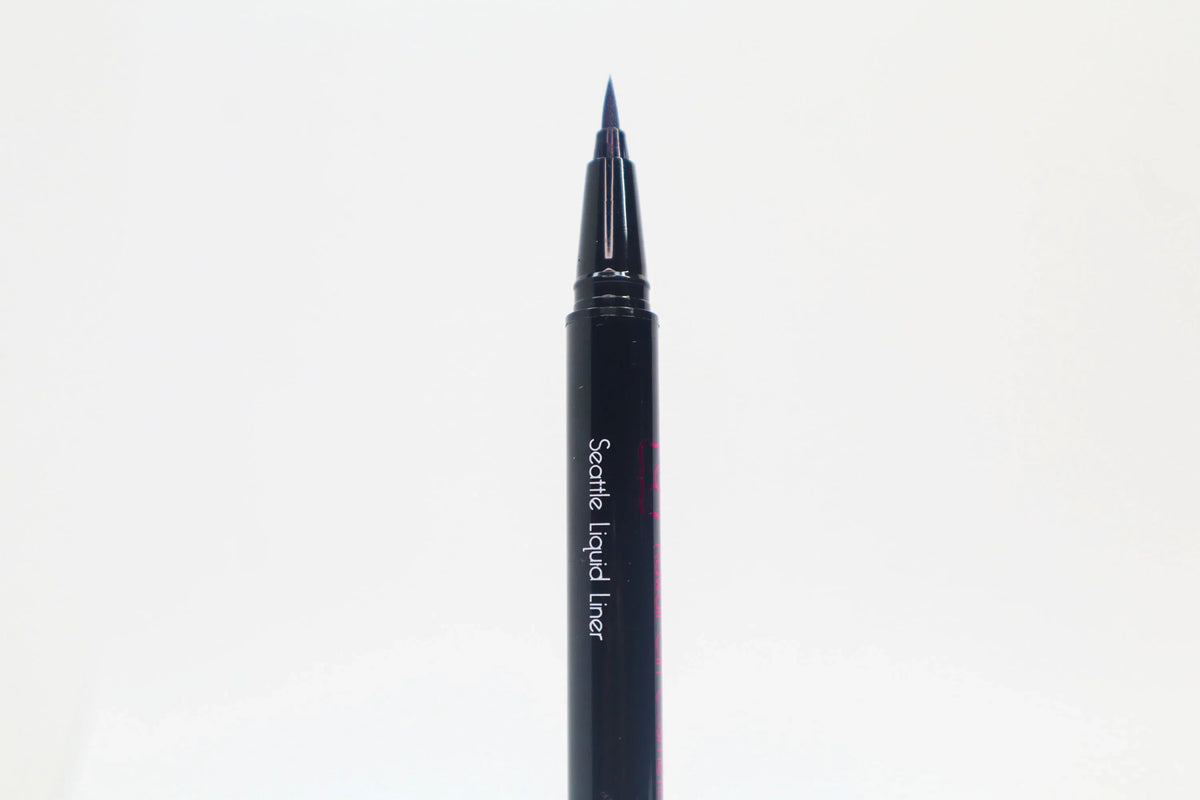Close-up of Queen Anne Liquid Liner packaging with royal blue liquid liner and product name on a white background.