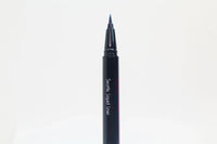 Close-up of Queen Anne Liquid Liner packaging with royal blue liquid liner and product name on a white background.