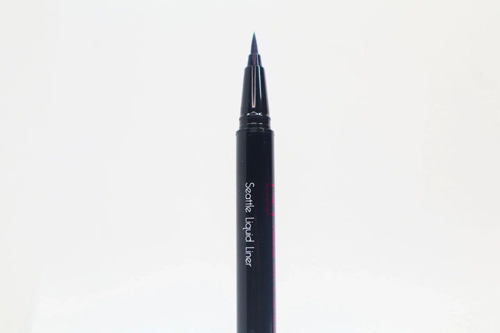 Close-up of Queen Anne Liquid Liner packaging with royal blue liquid liner and product name on a white background.