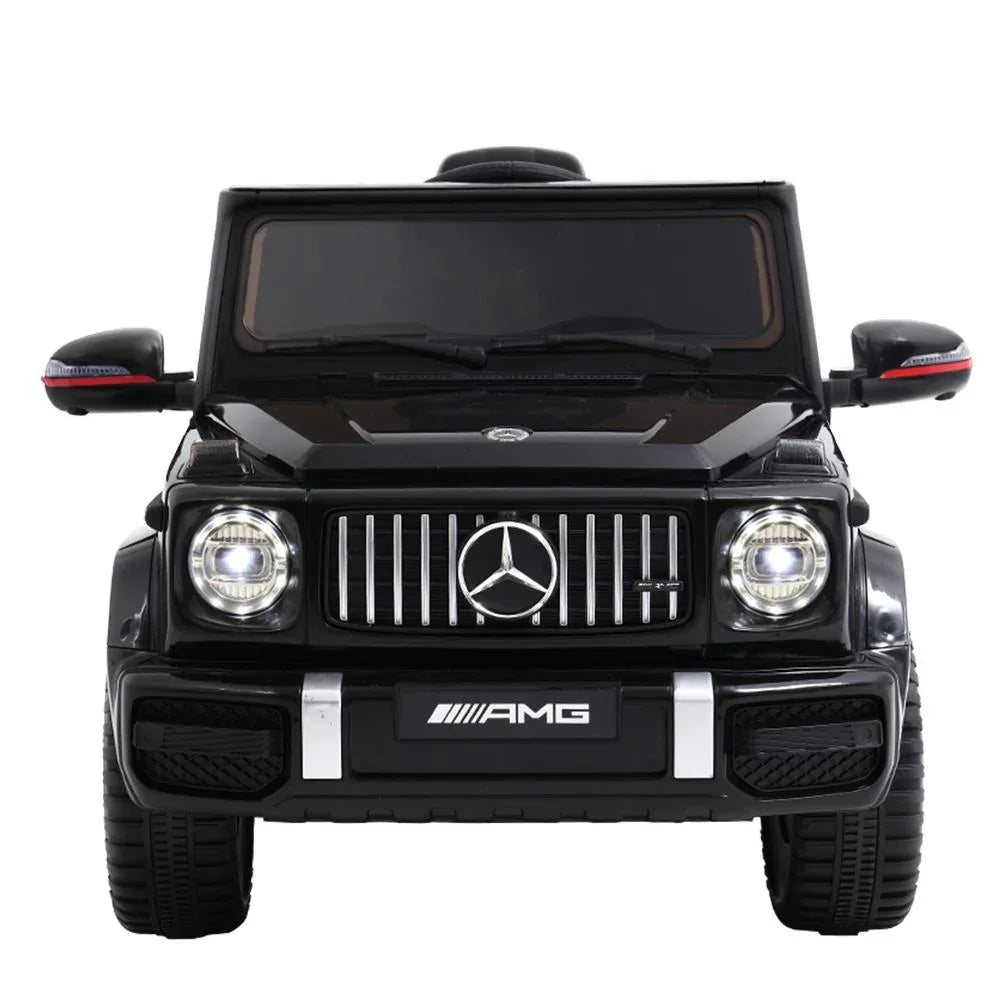Close-up of black Mercedes-Benz AMG G63 kids ride on car dashboard and steering wheel