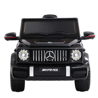 Close-up of black Mercedes-Benz AMG G63 kids ride on car dashboard and steering wheel