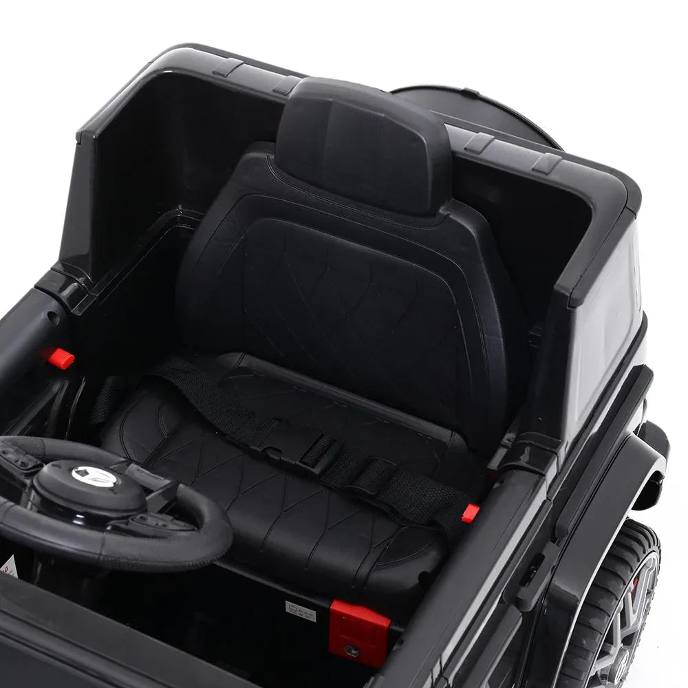 Black Mercedes-Benz AMG G63 electric kids ride on car showing wheel and suspension