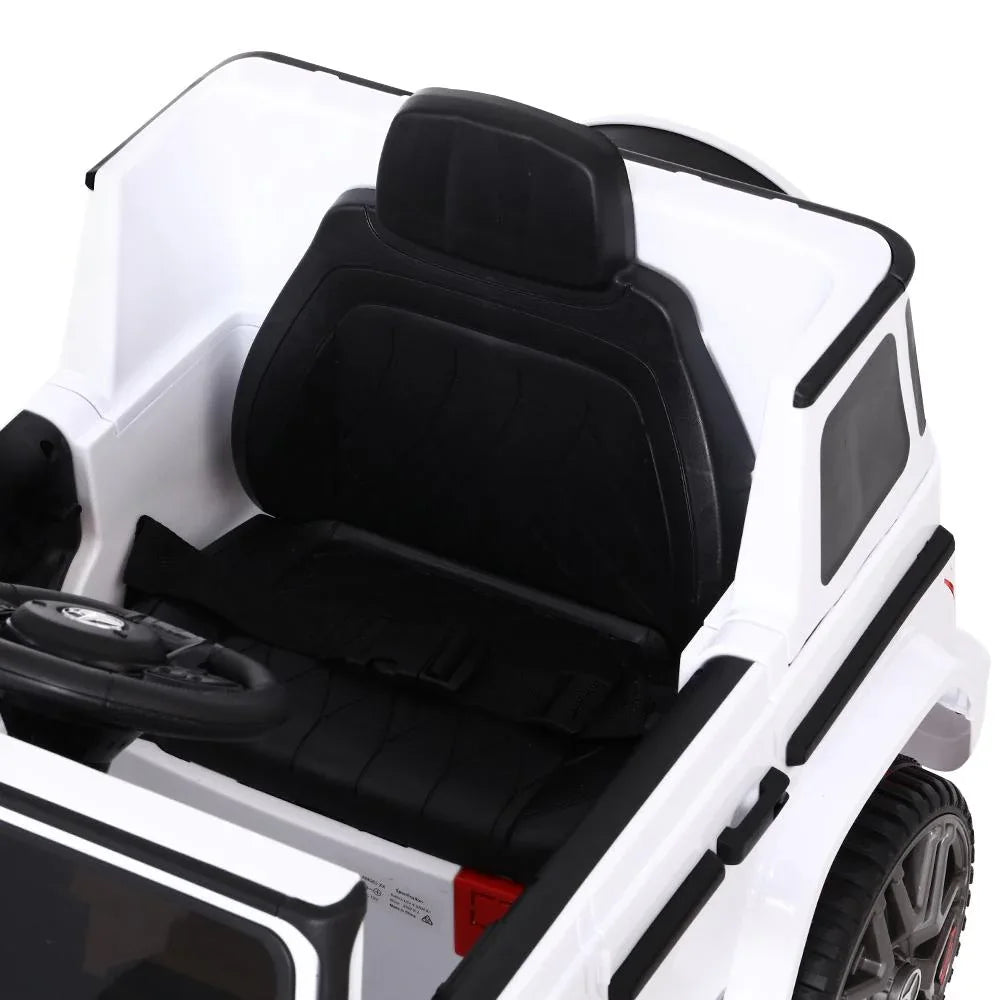White kids ride-on AMG G63 electric car angled view highlighting design and suspension