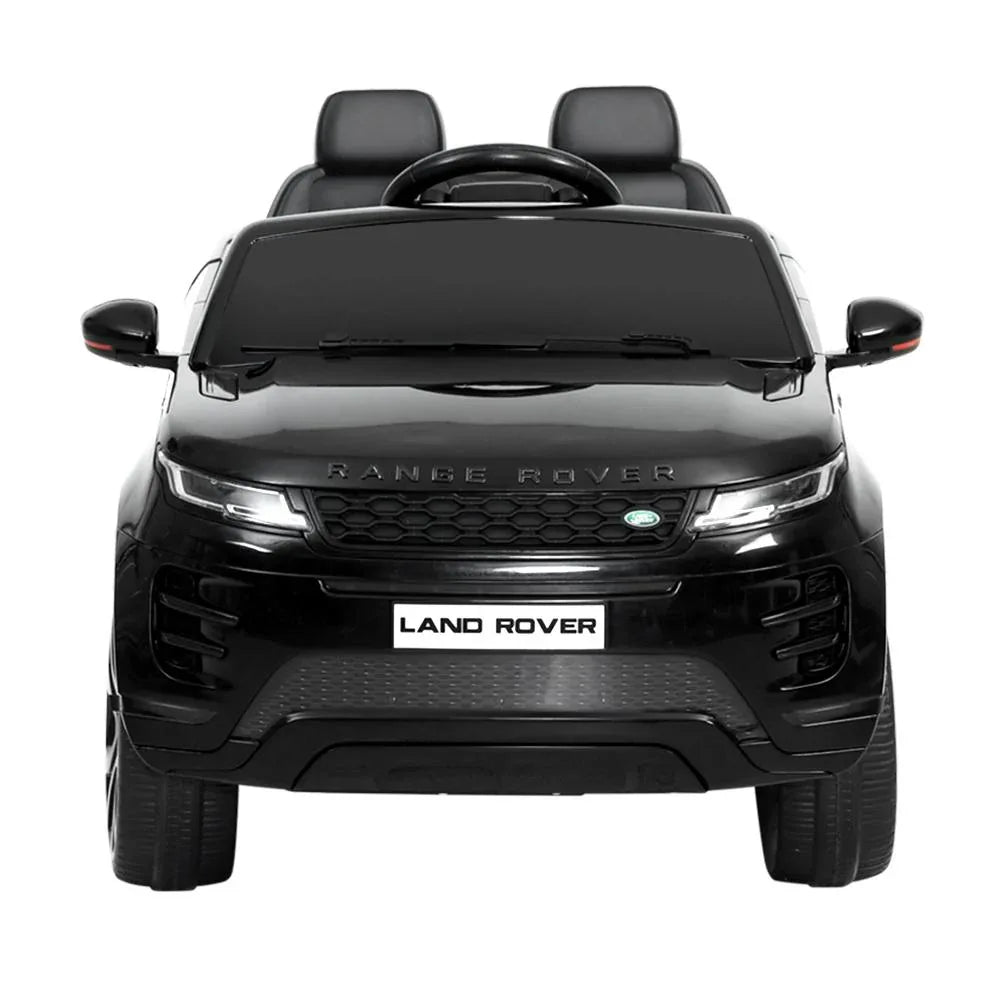 Rear right side of black electric kids ride on Land Rover Evoque showing seats and wheels.