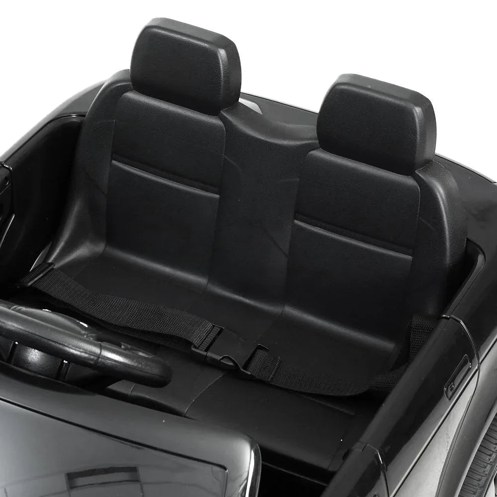 Top view of black Land Rover Evoque kids electric car showing seat and control panel.