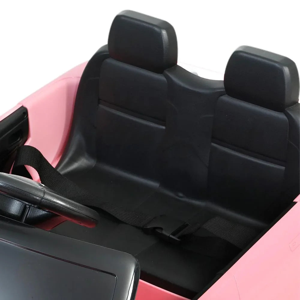 Close-up of the dashboard and steering wheel of the kids electric ride-on Land Rover Evoque car toy