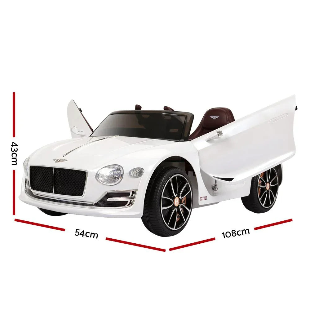 Side profile of white electric ride on car showing detailed wheels and premium glossy finish.