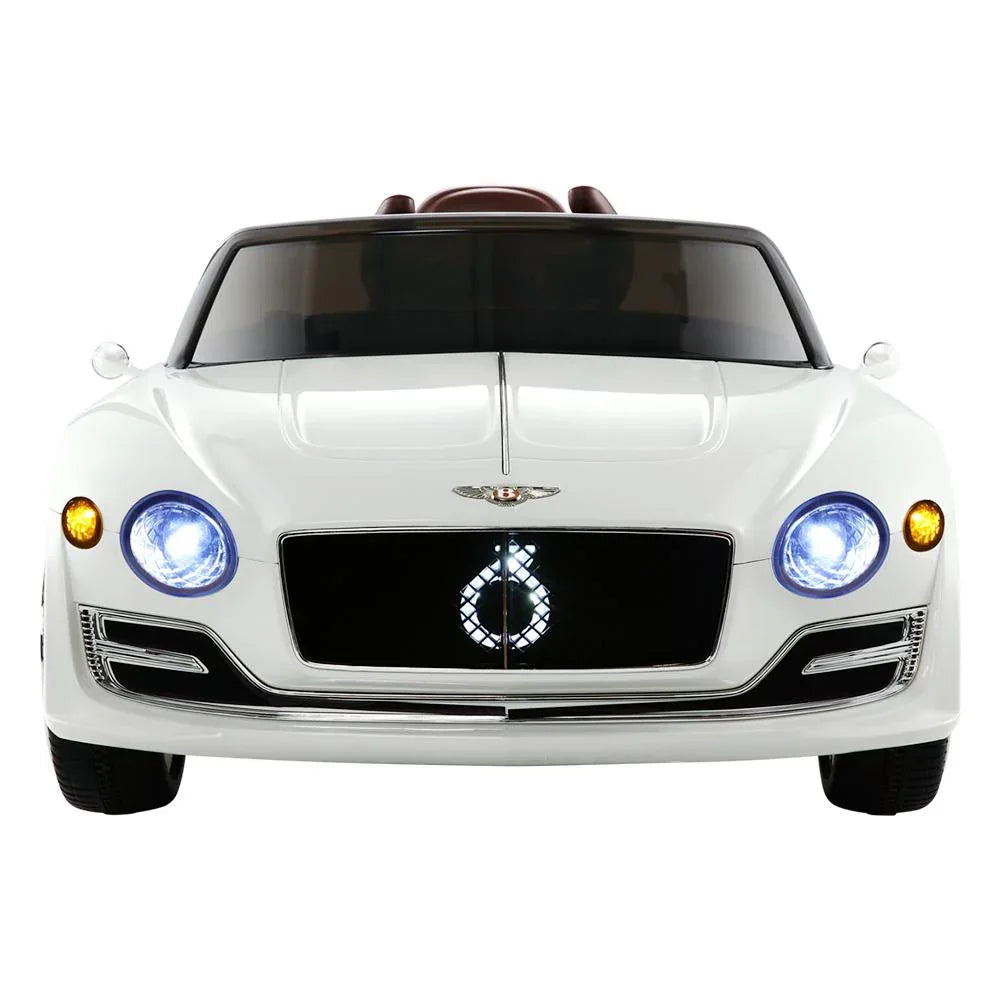 Close-up on the white ride on car’s front grille and Bentley logo with sleek design accents.