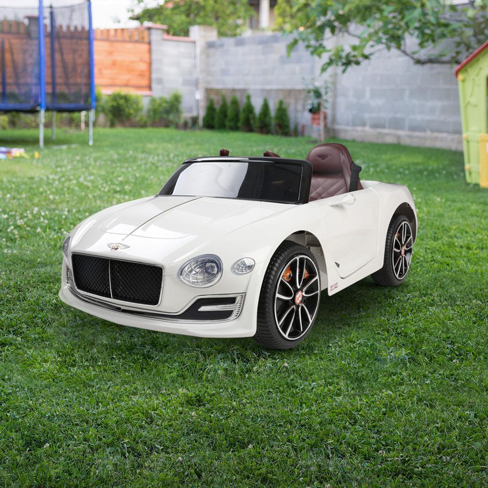 Close-up shot of the ride on car’s side mirrors and door handle in pristine white finish.