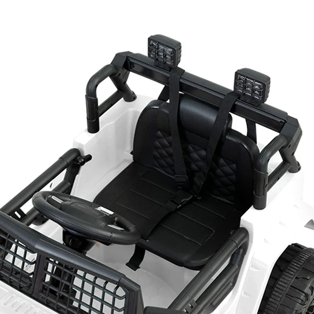Rear view of white electric kids ride on jeep highlighting taillights and seat.