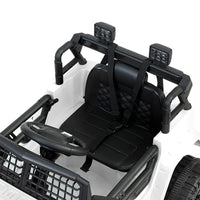 Rear view of white electric kids ride on jeep highlighting taillights and seat.